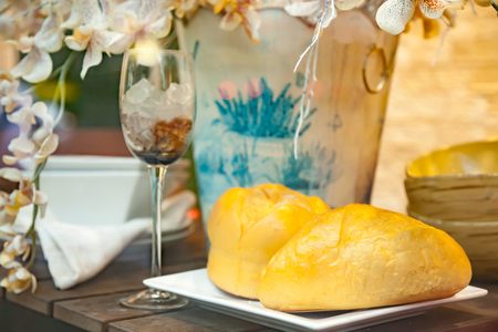 a bread and decorative on table in dining room.の写真素材