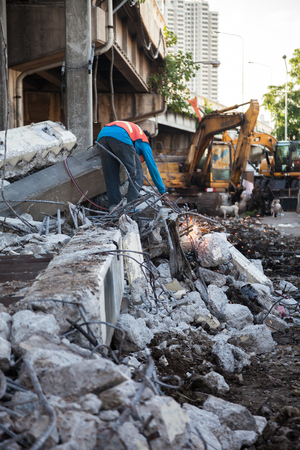 Technician cutting steel with gas and have fire sparkling in site construction.の写真素材