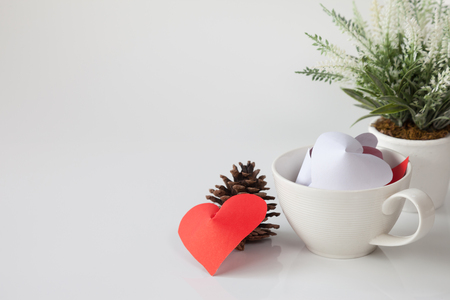 Paper heart in cup of coffee and decorative items. This is the symbol of love. For In February 14th, which was a day of love.の写真素材