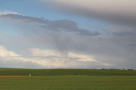 The raining cloud behind and catch up with the carの写真素材