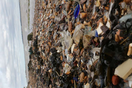 Mix rock stone glass sea waste on the beachの写真素材