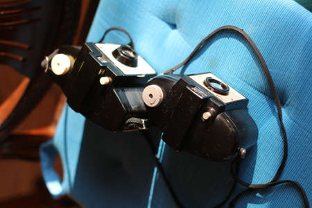 Two old vintage camera on the blue mattの写真素材