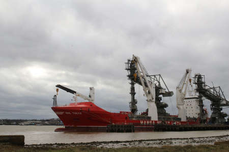 Ship with crane on the seaの写真素材