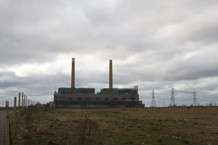 Two Old chimneys in the industrial buildingの写真素材