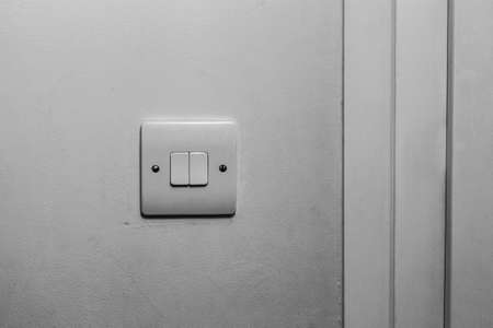 Double white switches on the wallの写真素材