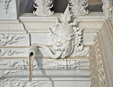 Native Thai style Giant statue as Water drain in Rong Khun Temple, Chiang Rai Thailand