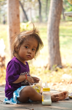 Little girl with milk in Laosのeditorial素材