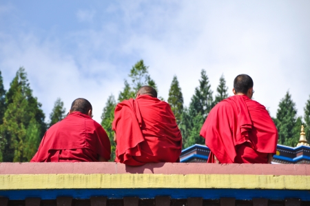 GUNGTOK, SIKKIM, INDIA - OCT 24, 2011: Three Unidentified Tibetian lamas at Ramtek Monastery in Gungtok, Sikkim, Indiaのeditorial素材