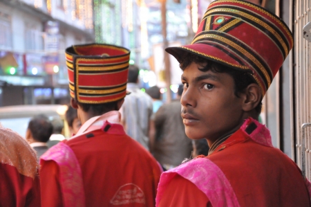 PELLING, SIKKIM, INDIA - OCT 27, 2011: AnUnidentified boy wares parade suit waits for the show in Gali Goddess calabration at Pelling, Sikkim, Indiaのeditorial素材
