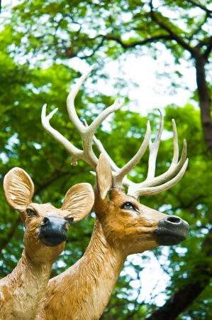 The model of deer with tree as background in Thailandの写真素材