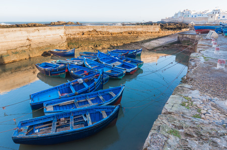 The blue boats park at of Skala du Port in Essaouira, Moroccoの写真素材