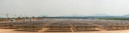 The solar farm for green energy in the field in Thailand as panorama picture with selective focus