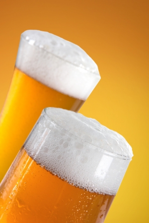 Glasses of beer close-up with froth の写真素材