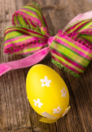 Painted Easter Eggs on wooden background の写真素材