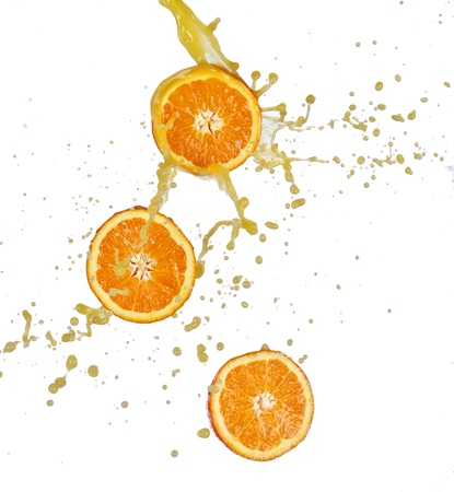 Orange splashing isolated on white の写真素材
