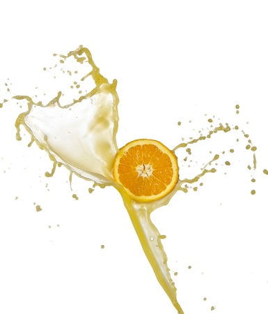 Orange juice splashing isolated on whiteの写真素材