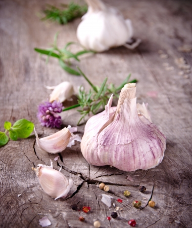 Fresh herbs and spices on wooden backgroundの写真素材