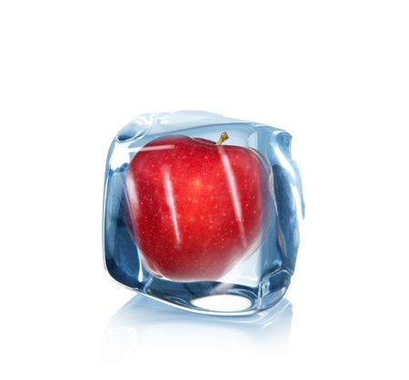 Apple in Ice cube over white の写真素材