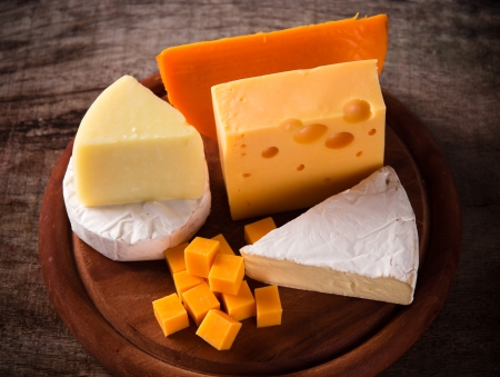 Various types of cheese on woodの写真素材