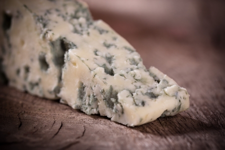 Blue cheese on wooden backgroundの写真素材
