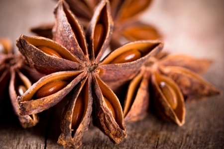 Anise stars on wooden backgroundの写真素材