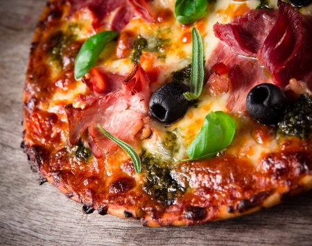 Tasty Italian pizza on wooden backgroundの写真素材