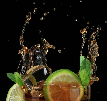 Cuba libre cocktail on black backgroundの写真素材