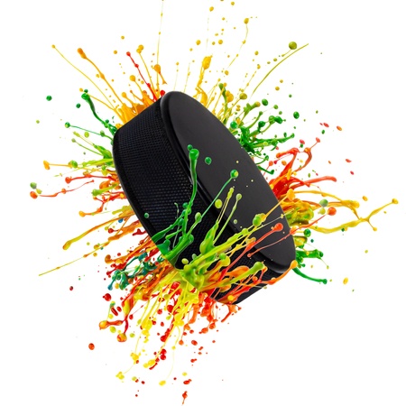 colorful splash with hockey puck on white background