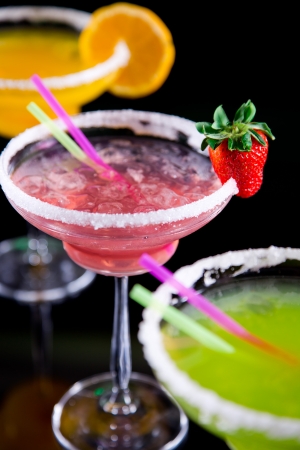 Fruit cocktails on black backgroundの写真素材