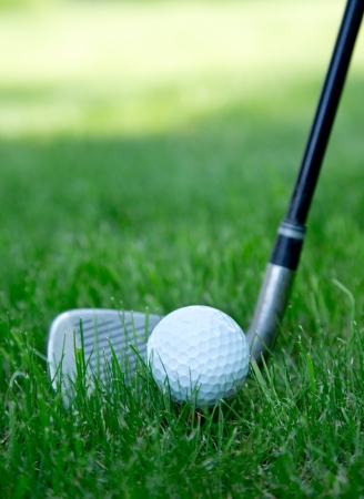 Close-up of golf ball on grassの写真素材