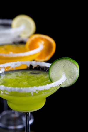 Fresh fruit cocktails over black backgroundの写真素材