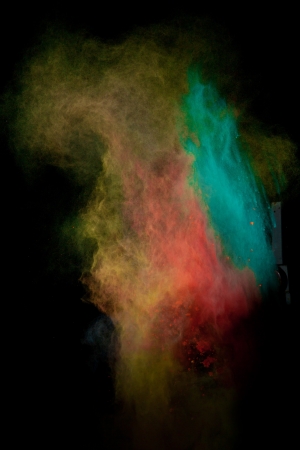 Launched colorful powder, isolated on black backgroundの写真素材