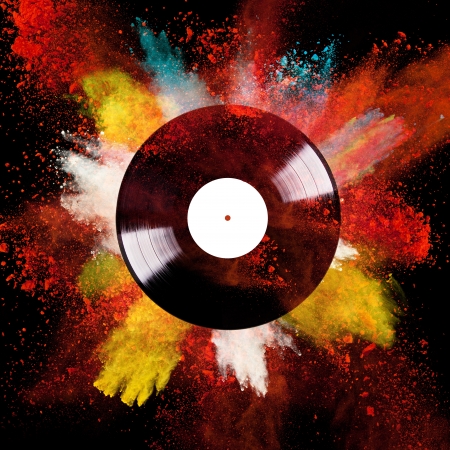Vinyl disc with colored powder over black backgroundの写真素材