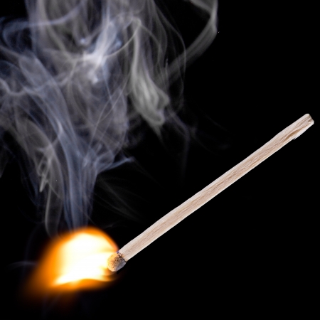 Blue safety matches over black backgroundの写真素材