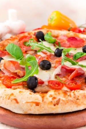 Delicious italian pizza served on wooden tableの写真素材