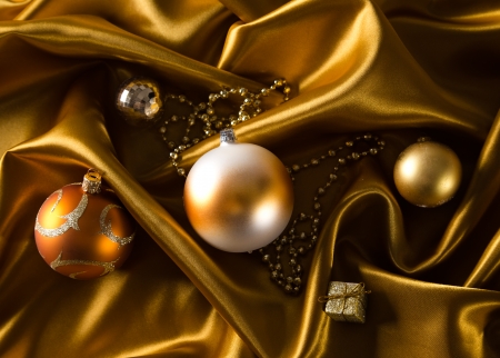 Abstract gold background with christmas balls on luxury clothの写真素材