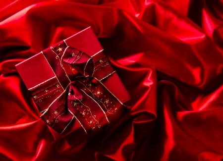 Red luxury satin with christmas ballsの写真素材