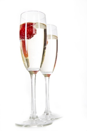 Pair of champagne flutes over white backgroundの写真素材