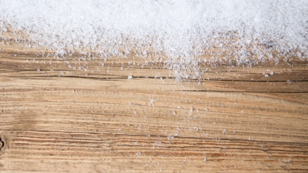 Old wood texture with snow flakesの写真素材