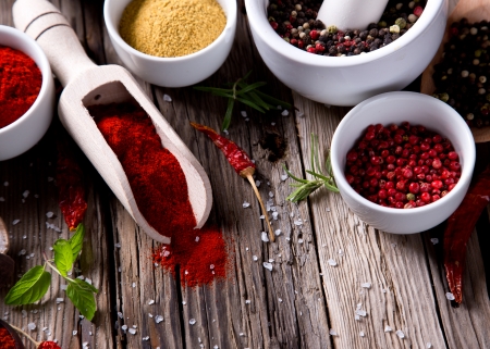 Assorted spices on wooden backgroundの写真素材