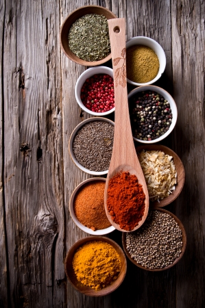 Assorted spices on wooden backgroundの写真素材