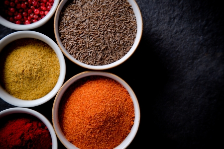 Assorted spices on stone backgroundの写真素材