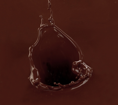 Splash of brownish chocolate isolated on white backgroundの写真素材