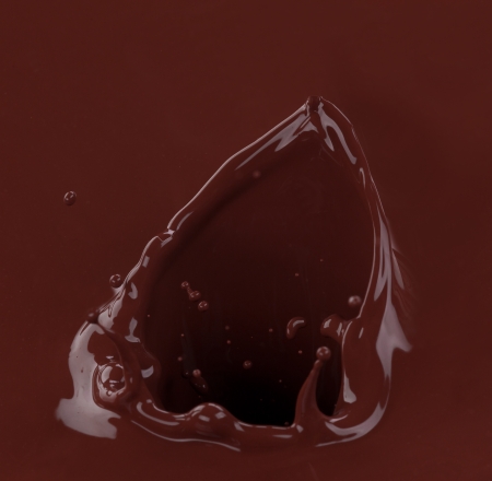 Splash of brownish chocolate isolated on white backgroundの写真素材