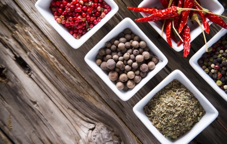 Assorted spices on wooden backgroundの写真素材