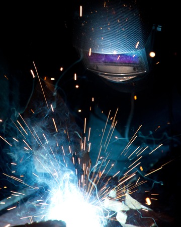 Working welder. Construction and manufacture theme.