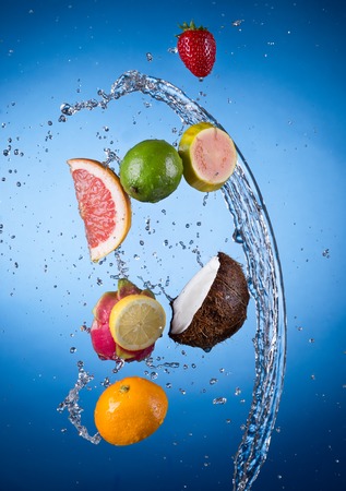 Fresh fruit with water splashの写真素材