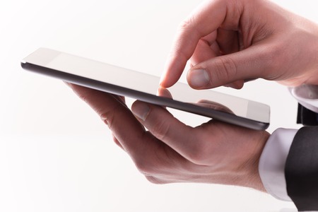 hand touching digital tablet, modern technology conceptの写真素材