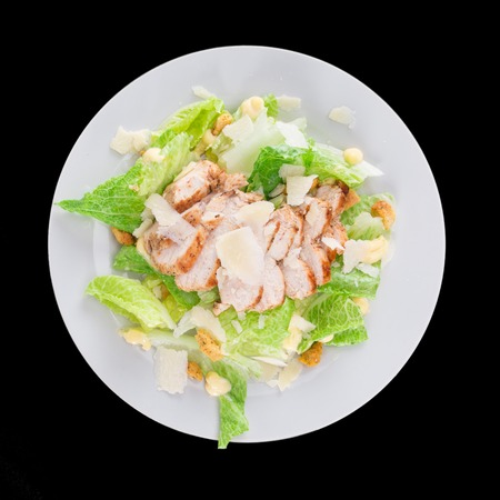 Caesar salad with chicken and greens の写真素材
