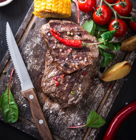 Tasty beef steak on wooden desk.の写真素材